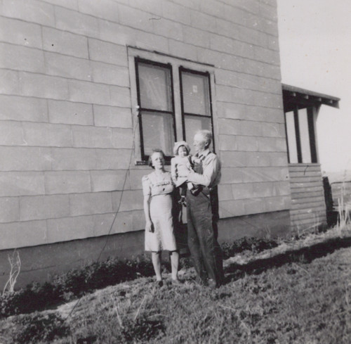 Frank and Mary in front of the house they built, after Elmer moved in.